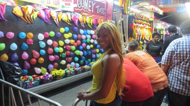 I am hoping to win a big teddy bear at this carnival game.
