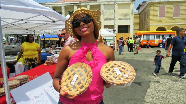 Africah holding delicious guava tarts.