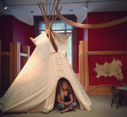 Africah hanging out in the  Teepee.