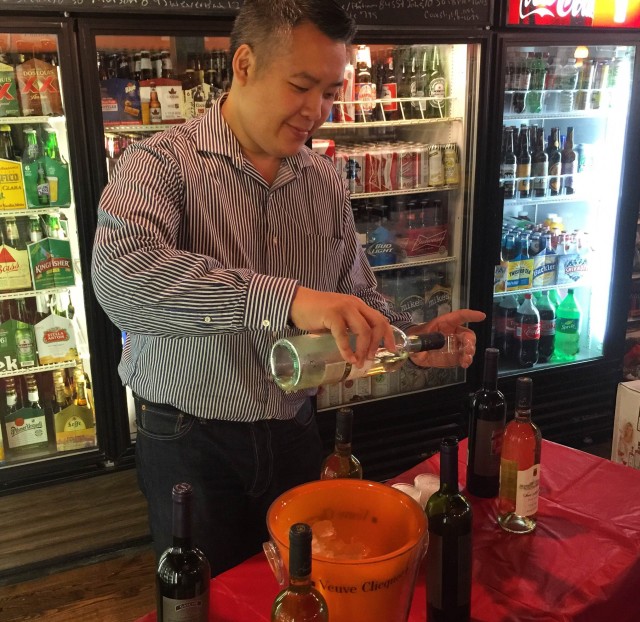 The manager pouring the wine.