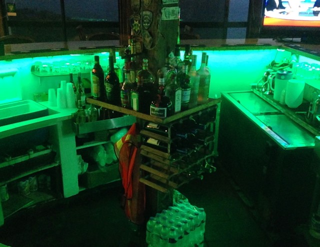 The lights change to a green color by the bar.